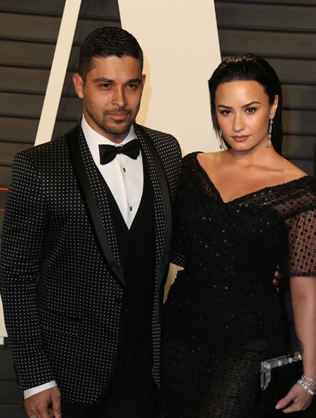 file photos ****FILE PHOTOS** HEARTBROKEN DEMI LOVATO ALL SMILES AT FIGHT NIGHT DEMI LOVATO put on a brave face while attending a fight night on Saturday (04Jun16), a day after revealing she and longtime boyfriend WILMER VALDERRAMA had split. The singer was all smiles as she and some friends hit UFC 199 at The Forum in Inglewood, California. The 23-year-old Cool for The Summer hitmaker and 36-year-old Wilmer posted a joint statement on Instagram late on Friday (03Jun16), announcing they had parted ways. "After almost 6 loving and wonderful years together, we have decided to end our relationship," they wrote. "This was an incredibly difficult decision for both of us, but we have realized more than anything that we are better as best friends." (KL/WNWCZM/RL)** Vanity Fair Oscar Party at Wallis Annenberg Center for Performing Arts - Arrivals Featuring: Wilmer Valderrama, Demi Lovato Where: Los Angeles, California, United States When: 28 Feb 2016 Credit: FayesVision/WENN.com